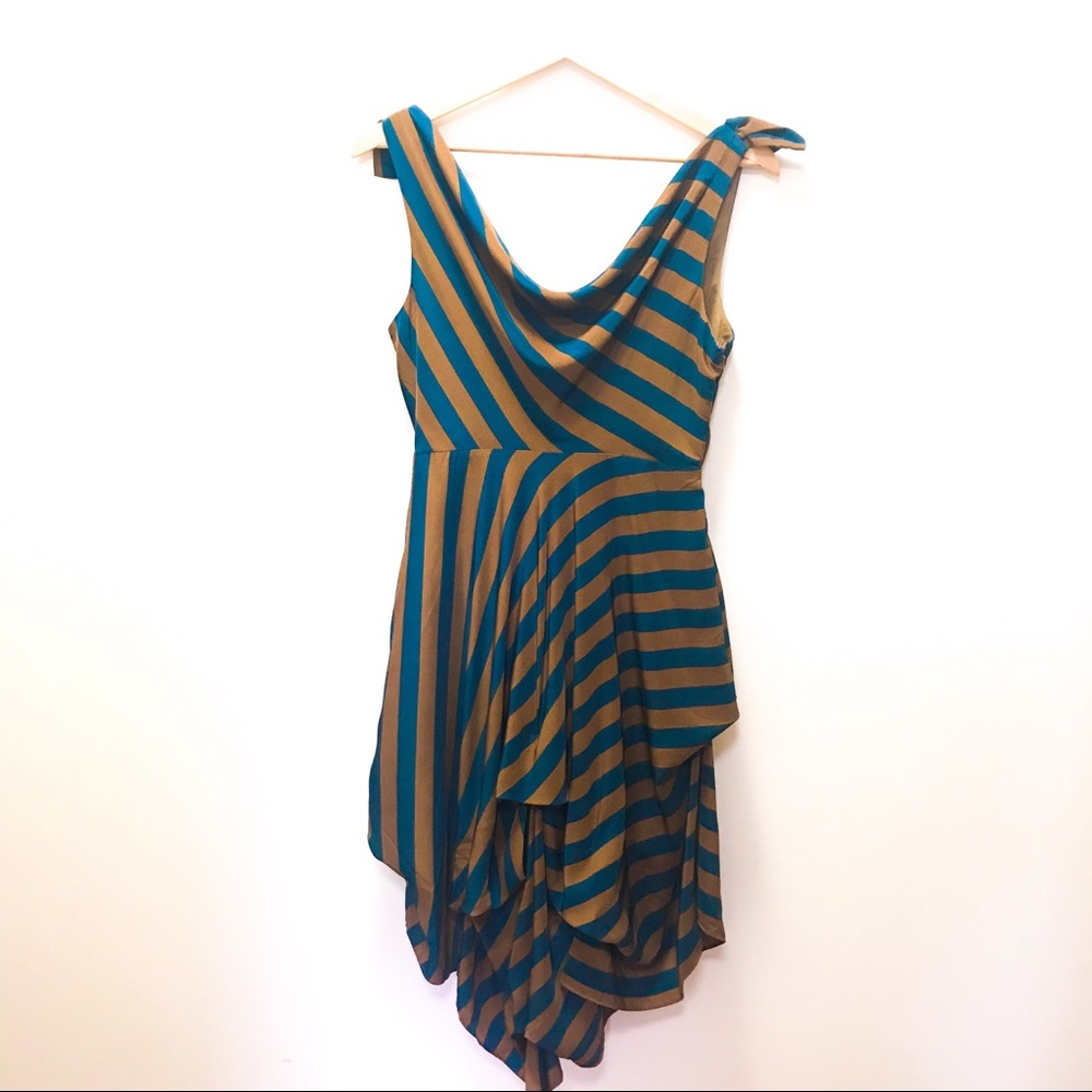 Given as a freebie Gorgeous unique bustle draped lowback dress
